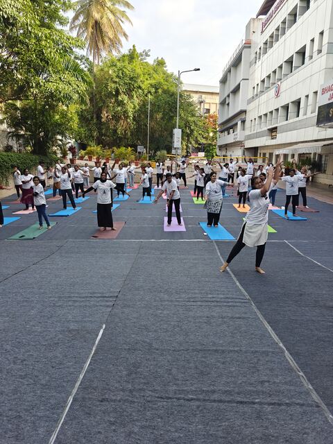Participants stretching with hands raised, smiling
