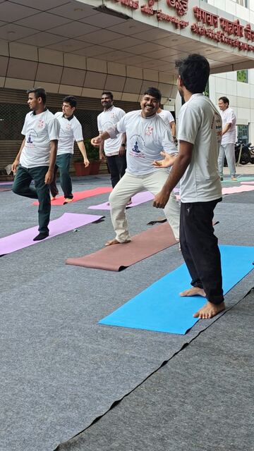 Participants laughing during a balance pose