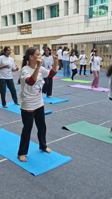 Participant leading a stretch routine on a yoga mat
